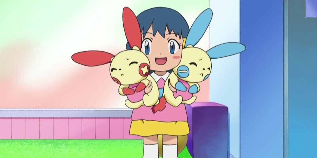 Baby Dawn carrying a Plusle and Minun in the Pokemon Anime
