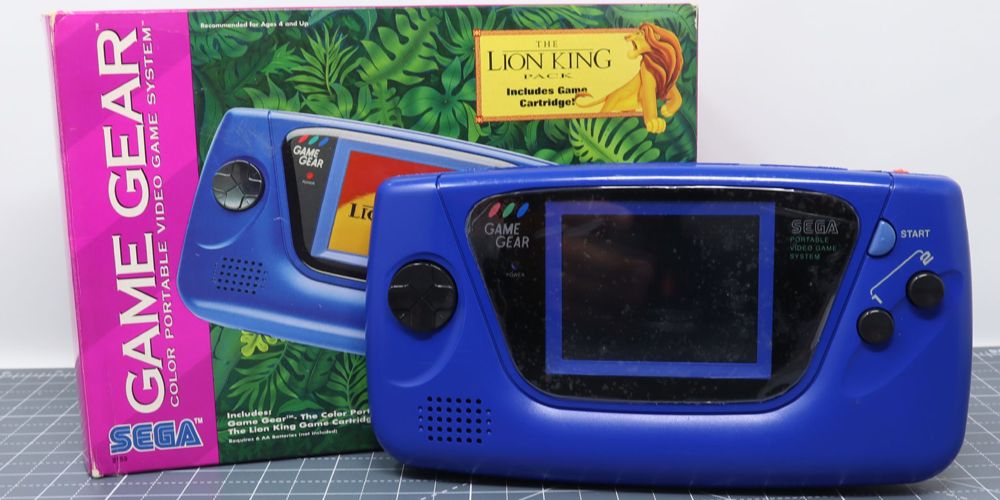 Game Gear console next to its box