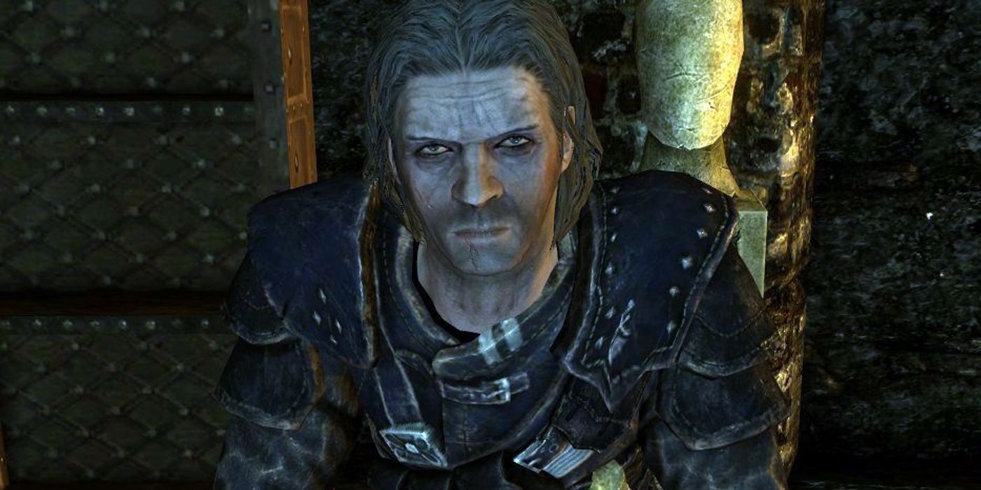 Skyrim screenshot of NPC Mercer Frey, showing his head and shoulders while he frowns at the player.