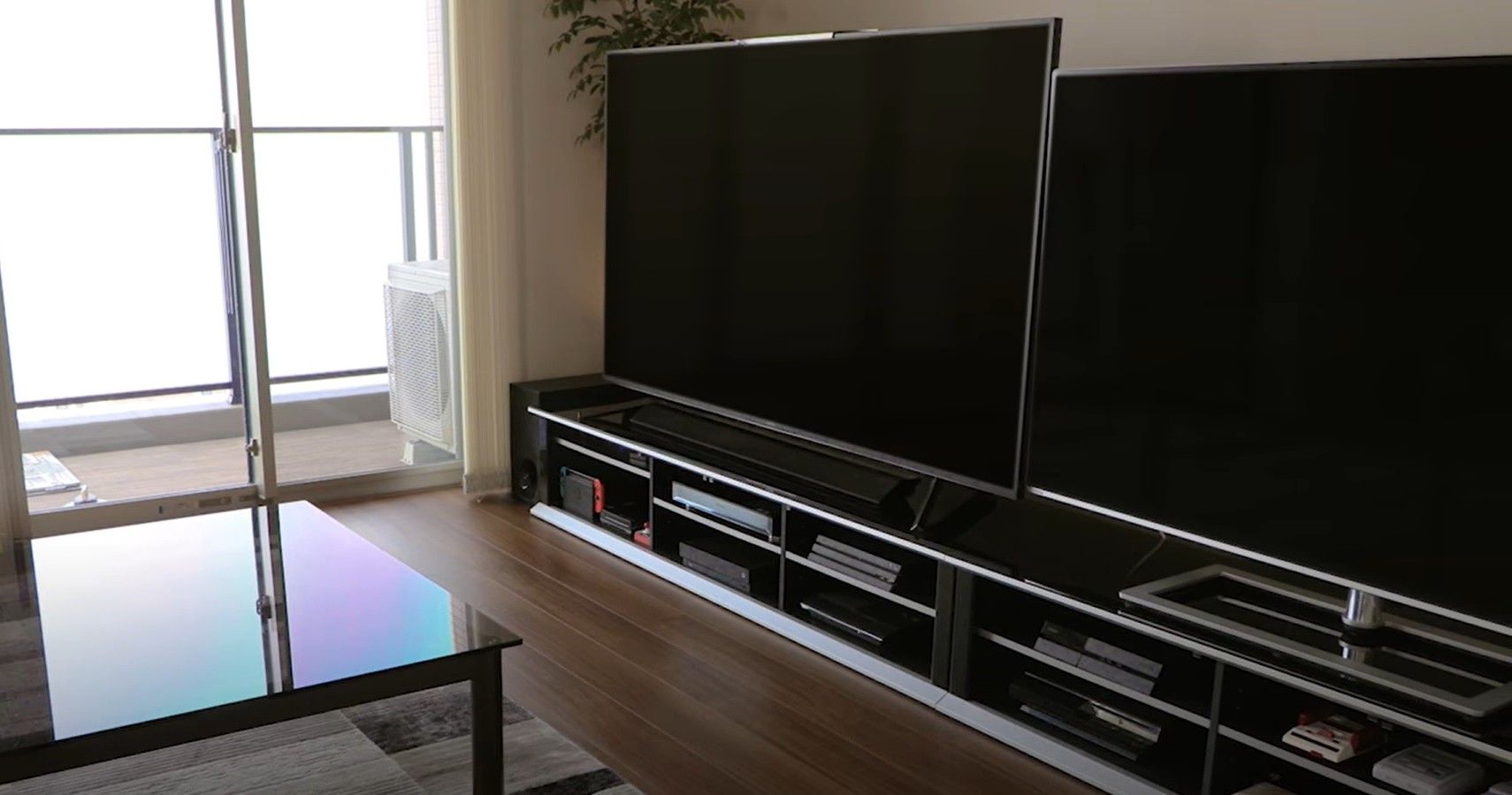 Two Tvs In A Living Room
