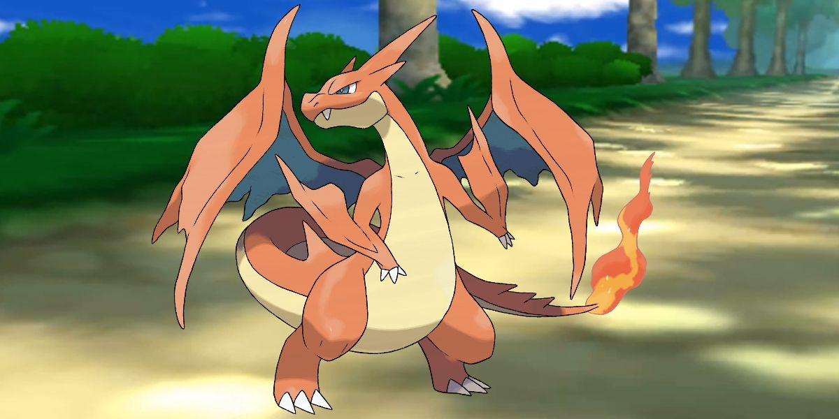 Pokemon Mega Charizard Y posing fiercely with trees and a road in the background.