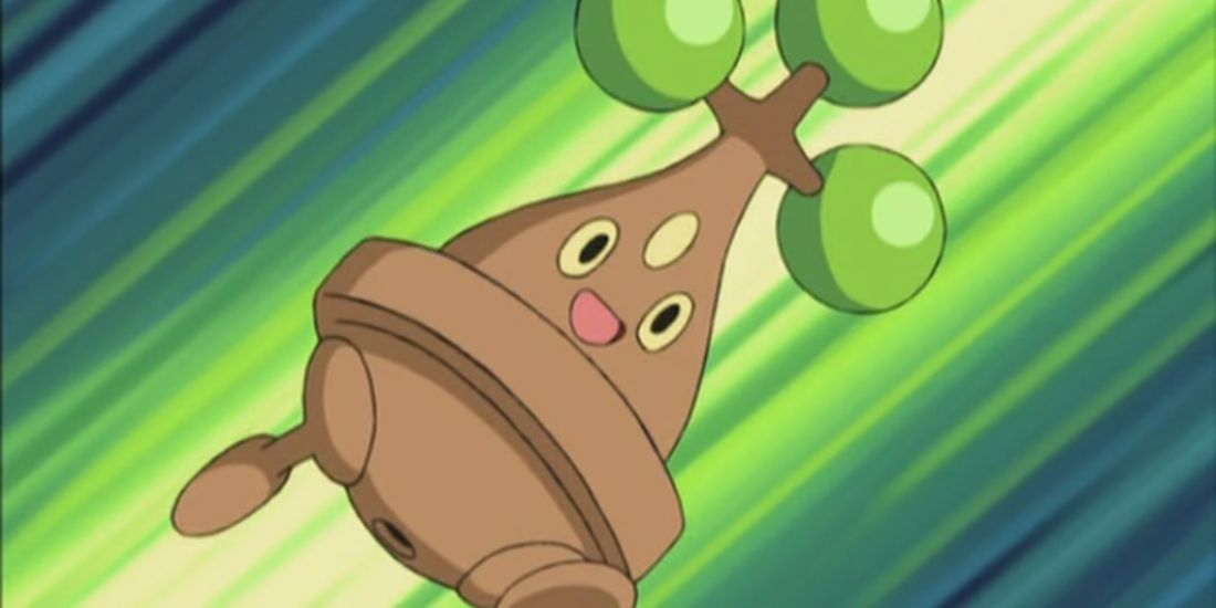 Bonsly flying through the air with a smile in the Pokemon Anime.
