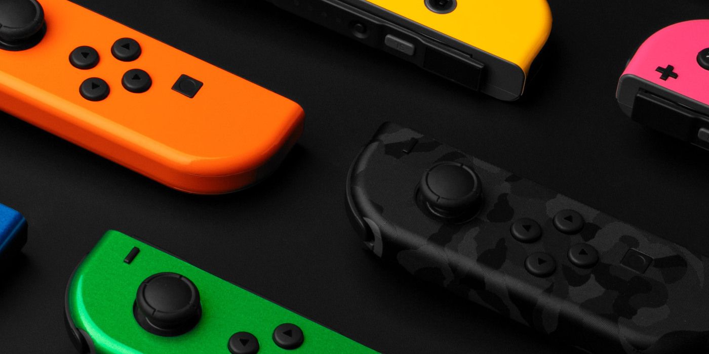 A row of Nintendo Switch Joy Cons laid out