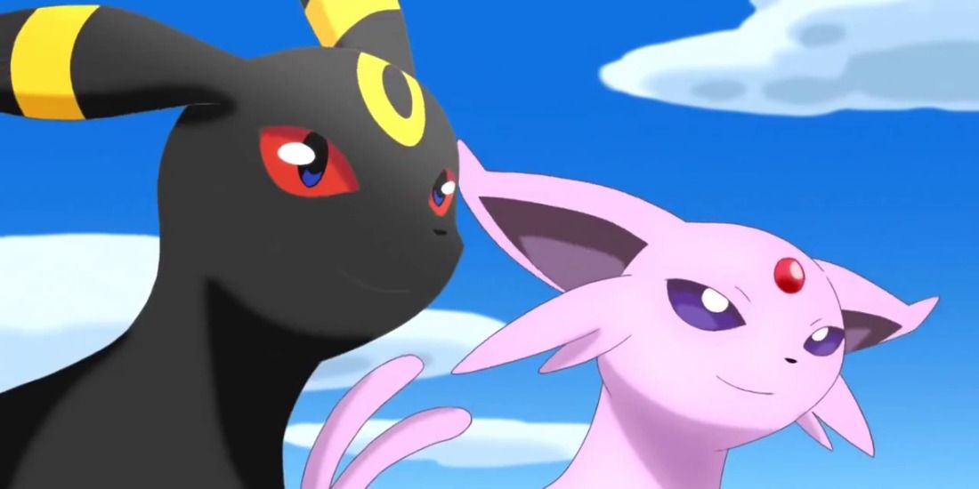 Espeon and Umbreon smiling under a cloudy, blue sky