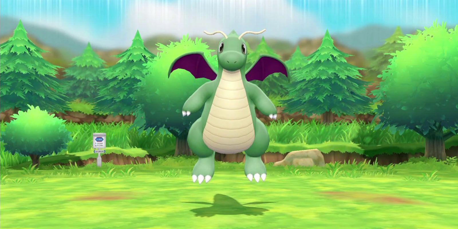 Pokemon Shiny Dragonite floating happily above the ground.