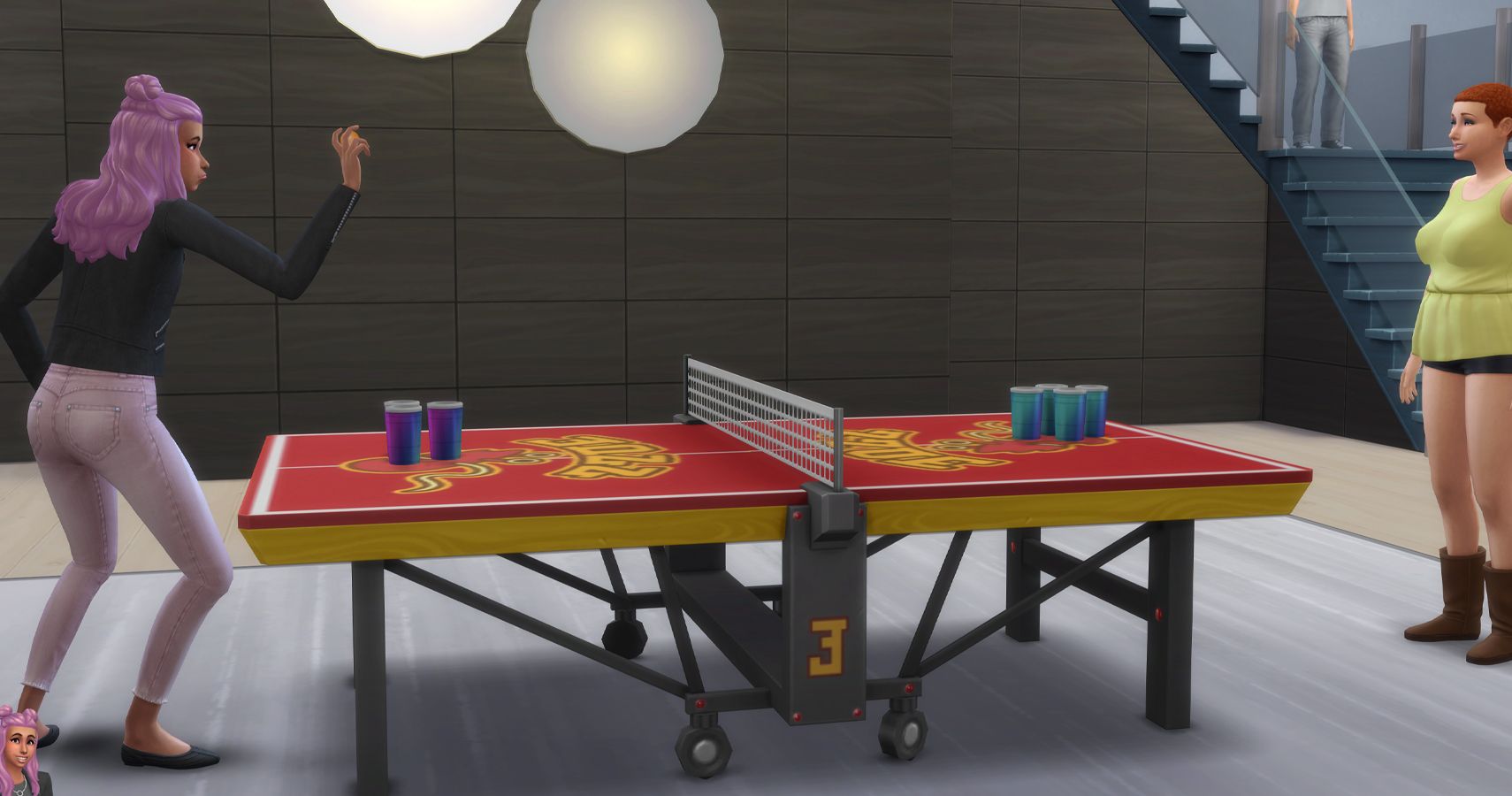 Two sims playing juice pong in the Foxbury common building.
