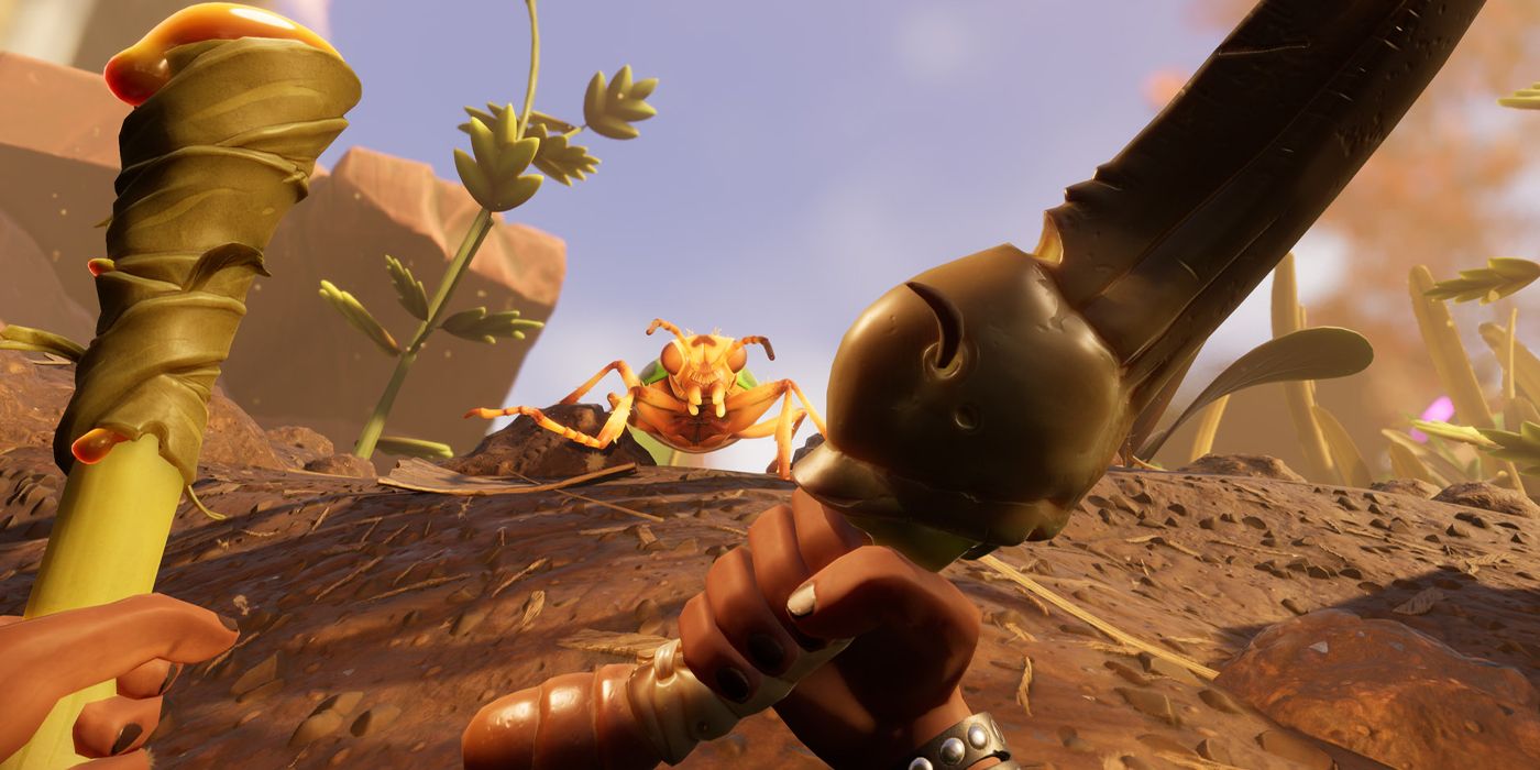 a first person view of an insect running toward the player as the player holds weapons ready for attack