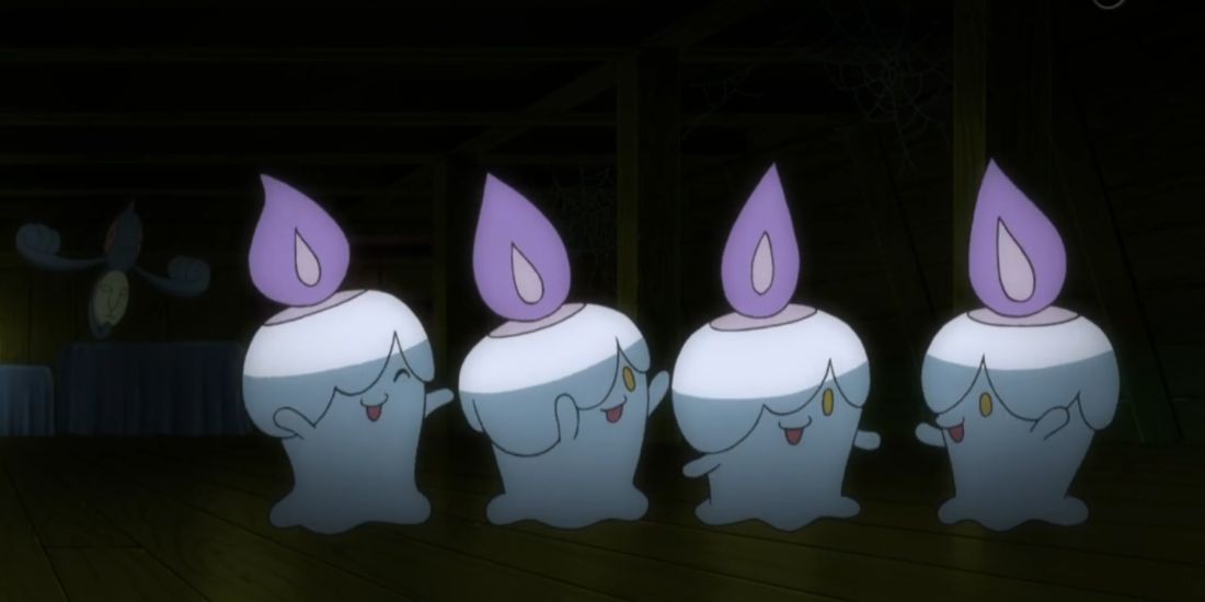 4 Litwick in Pokemon standing side by side.