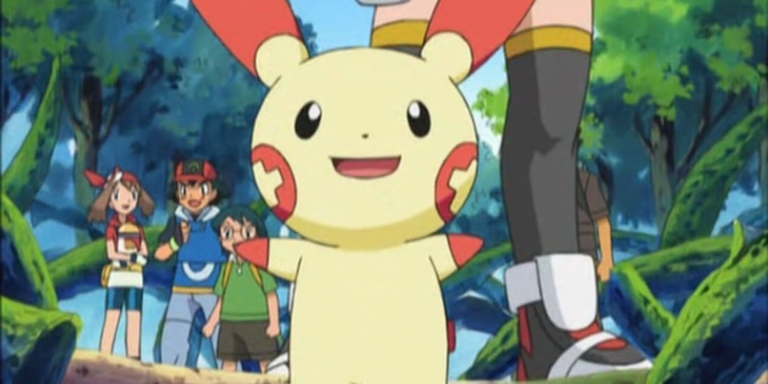 Plusle smiling at the camera with both arms wide while May, Ash, and Max are smiling in the background
