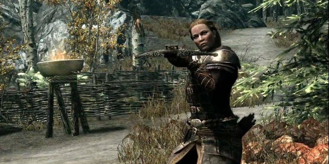 Skyrim: A female archer readies her crossbow at an unseen enemy