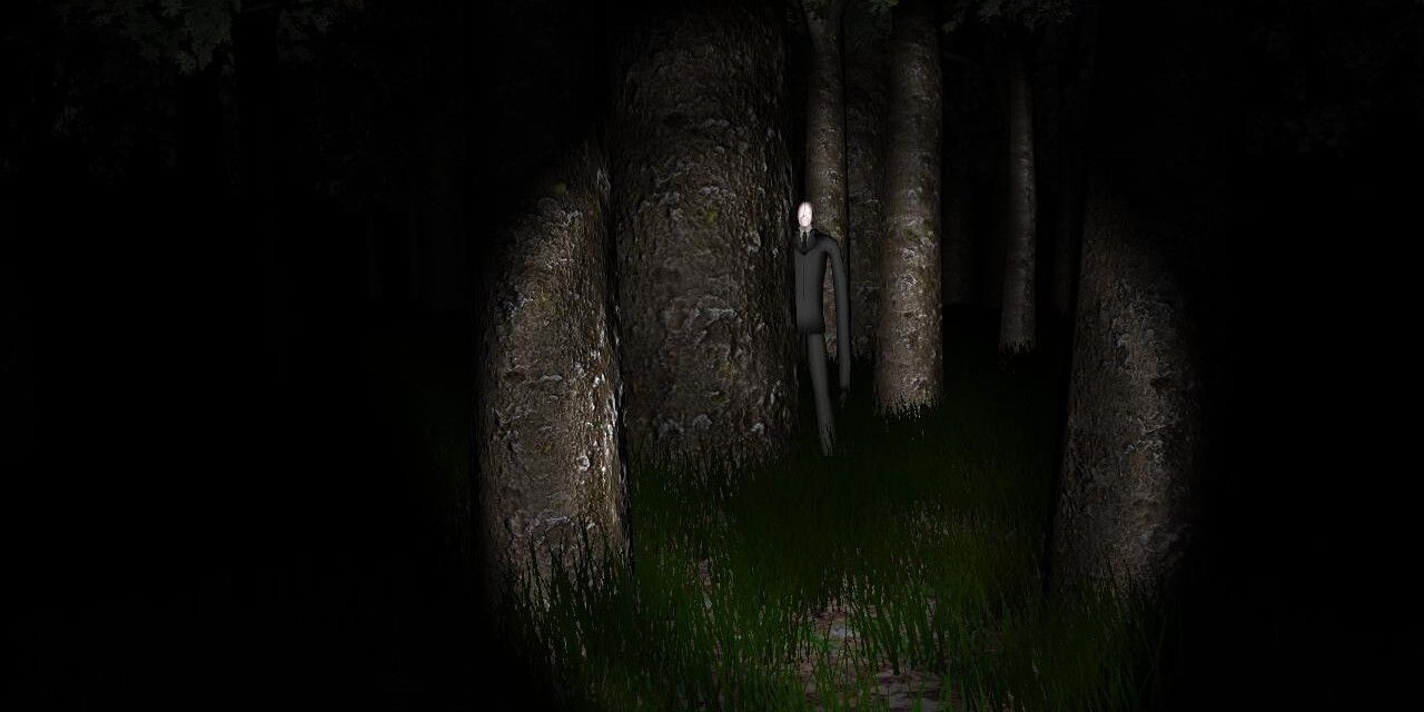 Slenderman behind the a tree from the original Slender game.