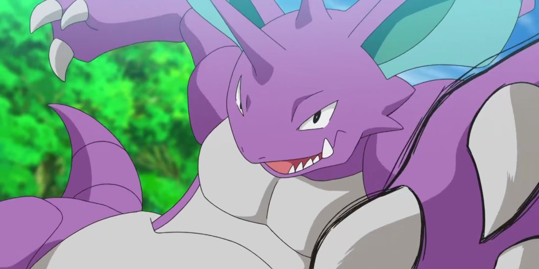 Nidoking reaches out to grab something in the Pokemon Anime.