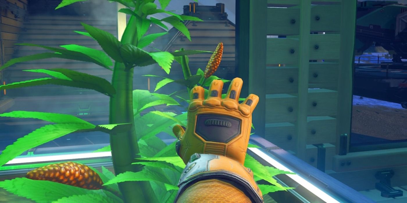 image of a player hand reaching to harvest Gek Nip in No Man's Sky