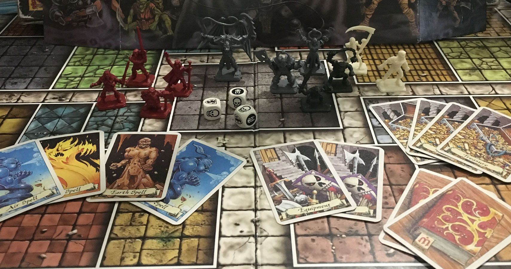HeroQuest cards and figures on the board