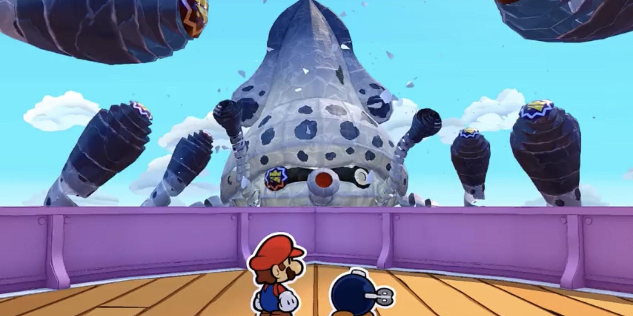 Mario battles a giant Paper Mache blooper in Paper Mario: The Origami King.