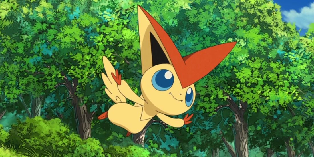 Victini flying free in a forest in the Pokémon anime