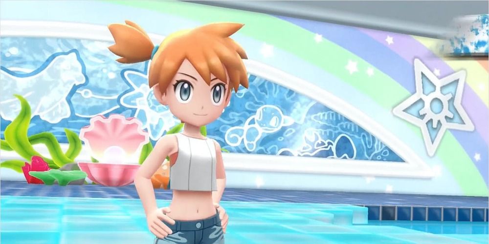 Misty with her hands on her hips at the pool in her Gym in Pokemon Let's Go.