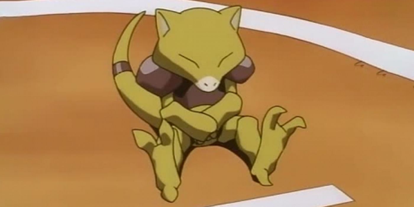 Abra sitting on the battlefield in the Pokemon Anime.