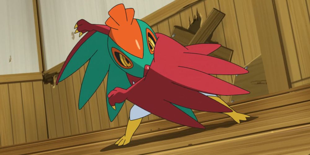 Hawlucha protecting itself with its wings in the Pokemon anime