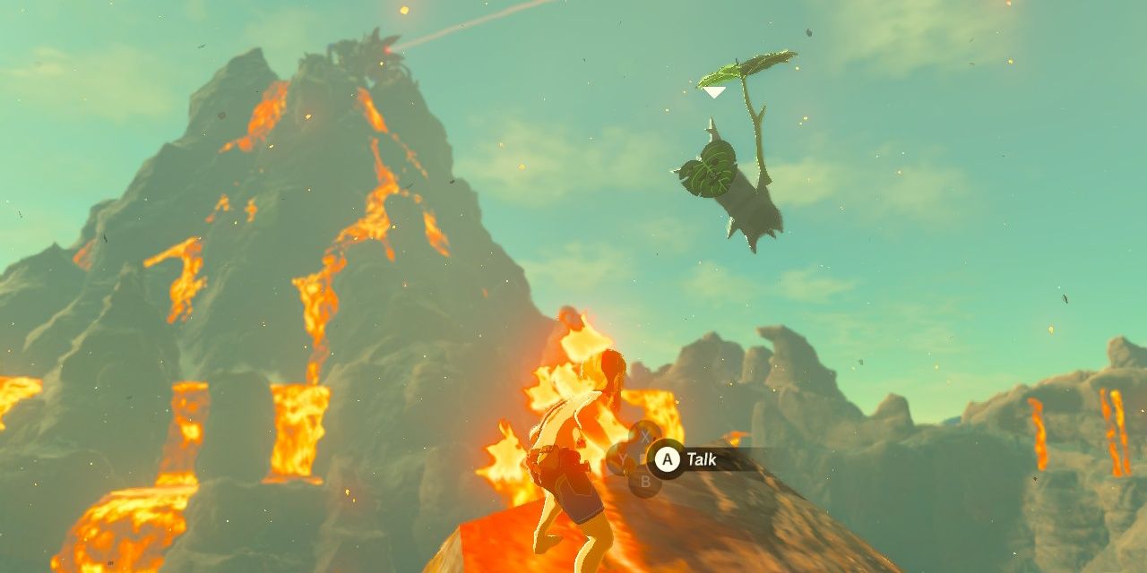 A Korok is flying towards Link while the latter is on fire.