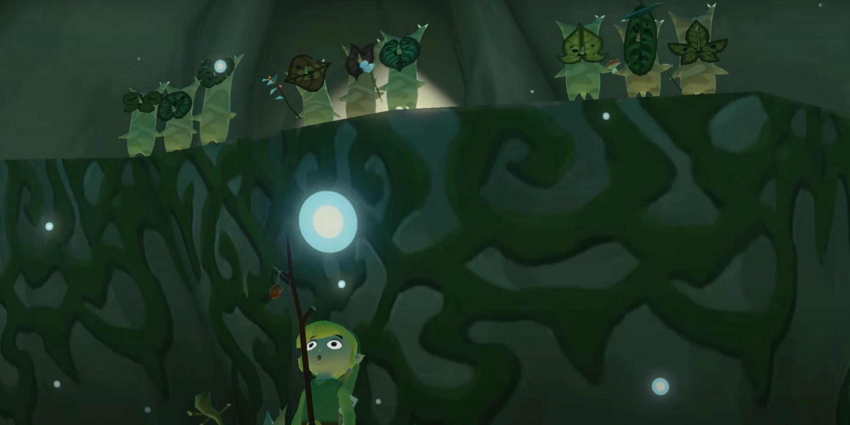 Toon Link with his eyes wide open while a group of Koroks are celebrating behind him.