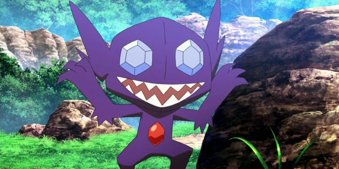 Ghostly Sableye scaring someone in a forest in the Pokemon Anime