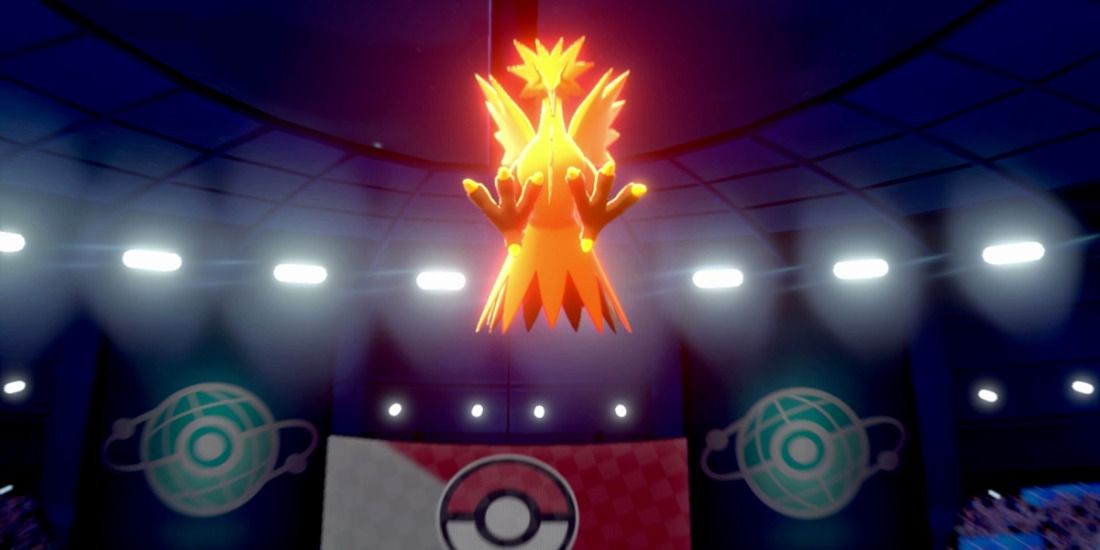 Zapdos leaping upwards to use Thunderous Kick in the Crown Tundra of Pokemon Sword & Shield