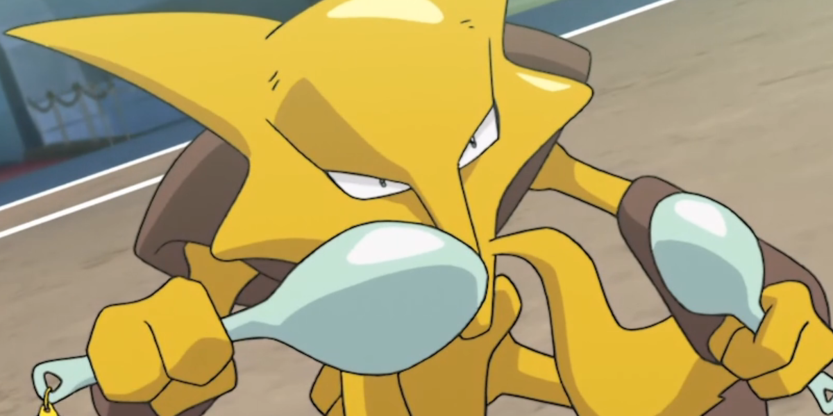 Alakazam with spoons standing in a battle field