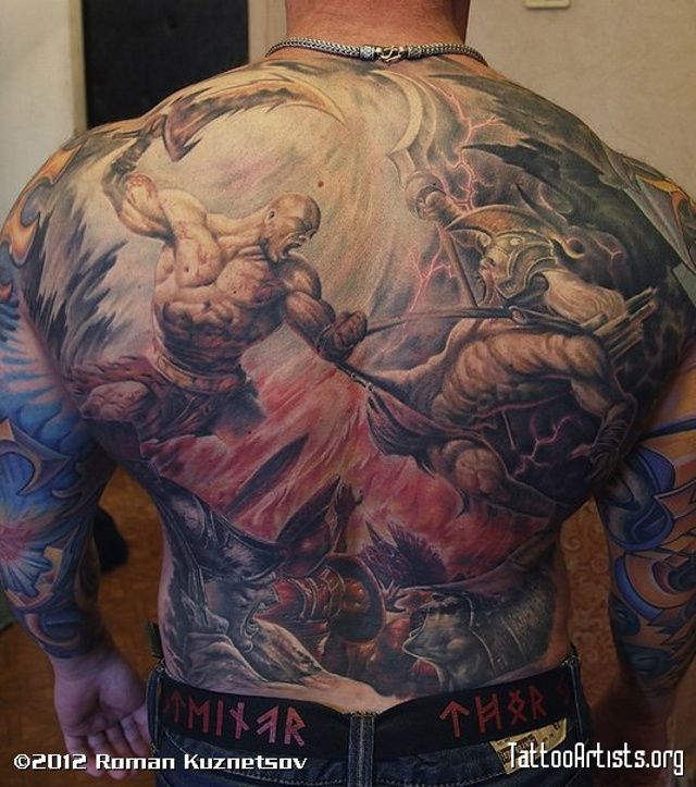 Tattoo of Kratos fighting mythological monster