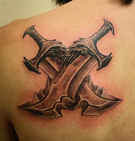 A tattoo of the Blades of Chaos.