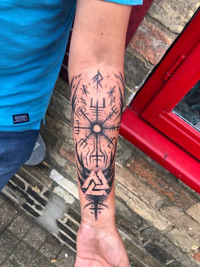 A God of War tattoo inspired by runes.