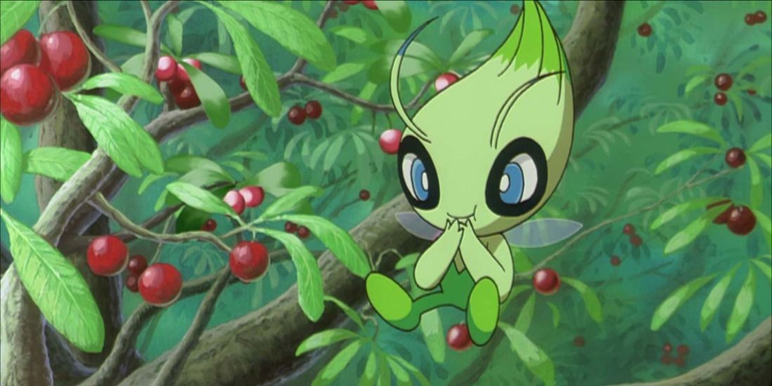 Celebi eating some berries in a field in a Pokemon anime movie.