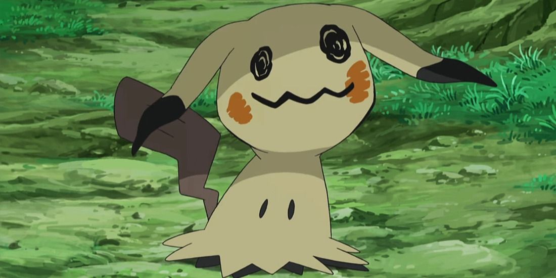 Mimikyu looking sad with its ears down in the Pokemon anime