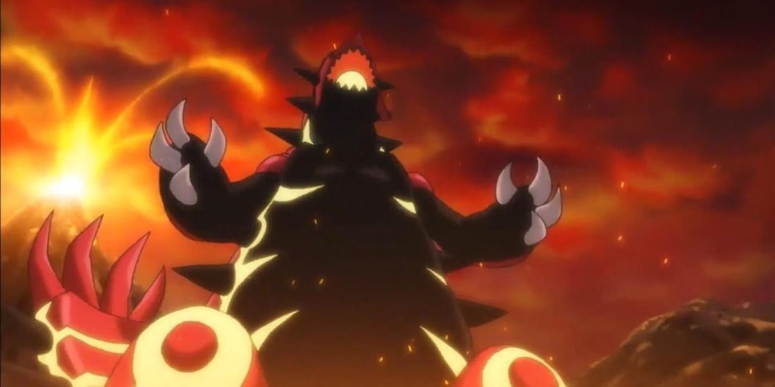 Primal Groudon standing over a Volcano in the Pokemon anime