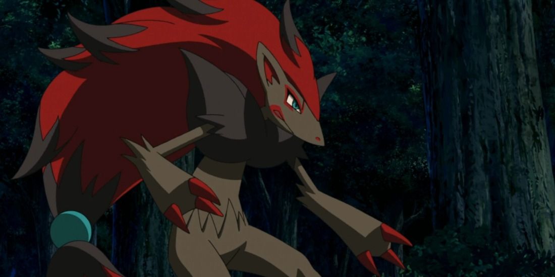 Zoroark standing in a dark forest in the Pokemon anime