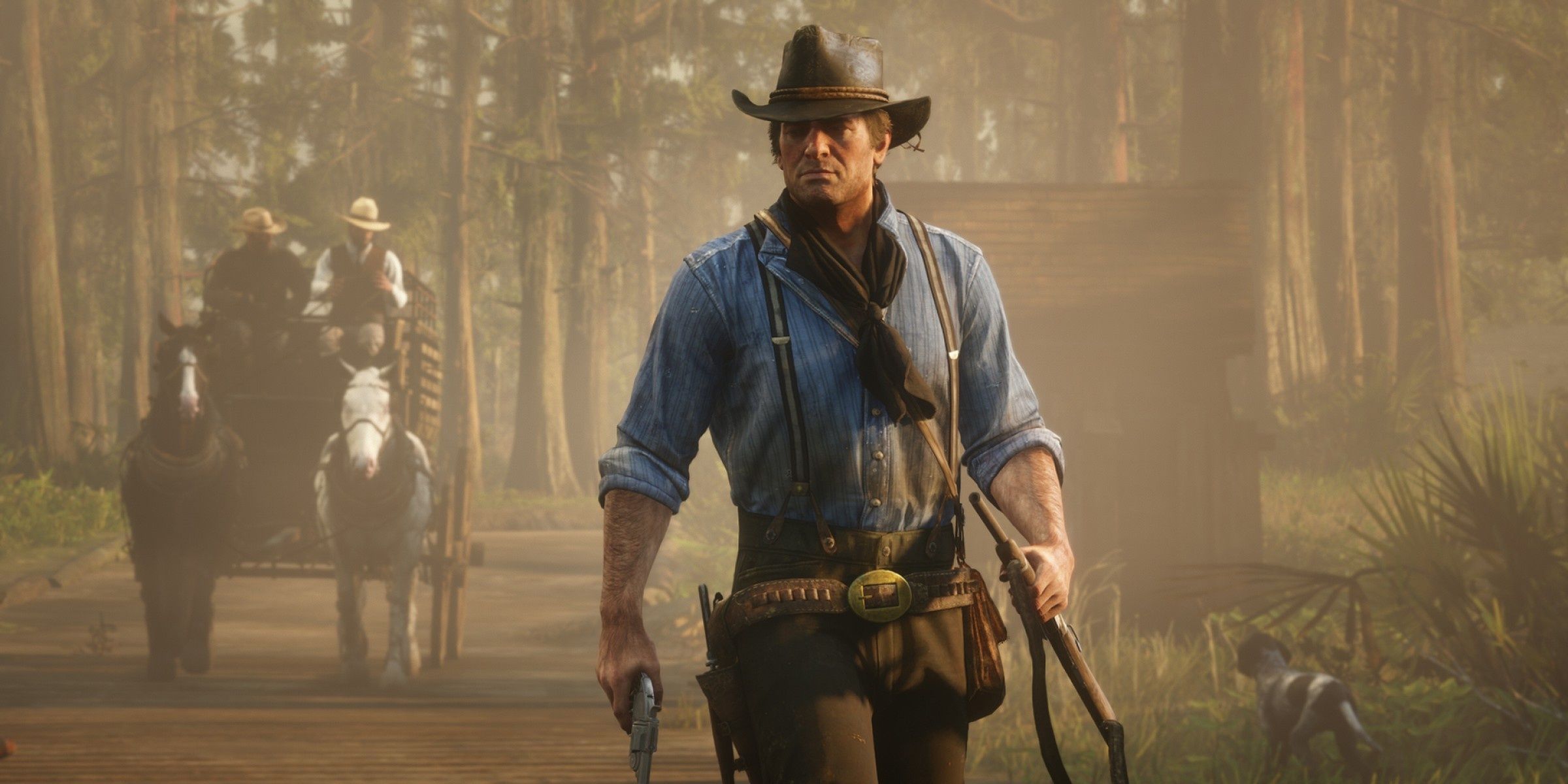 Arthur Morgan in Red Dead Redemption 2 holding a rifle in one hand and a revolver in the other on a foggy day.