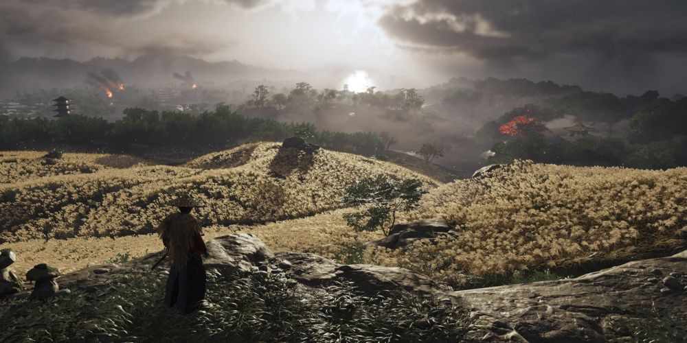 Ghost Of Tsushima Jin Sakai Overlooking Fields And Destroyed Towns