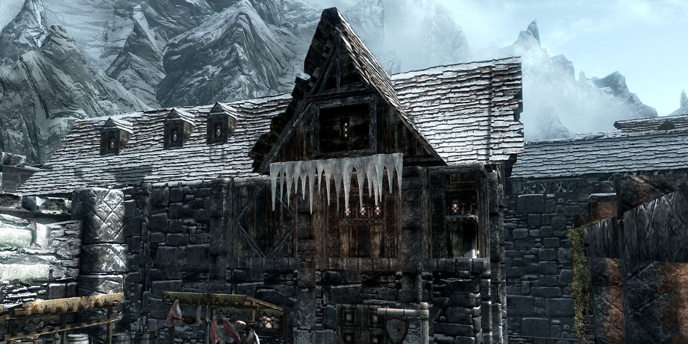 A store stands over a marketplace, covered in ice and snow. 