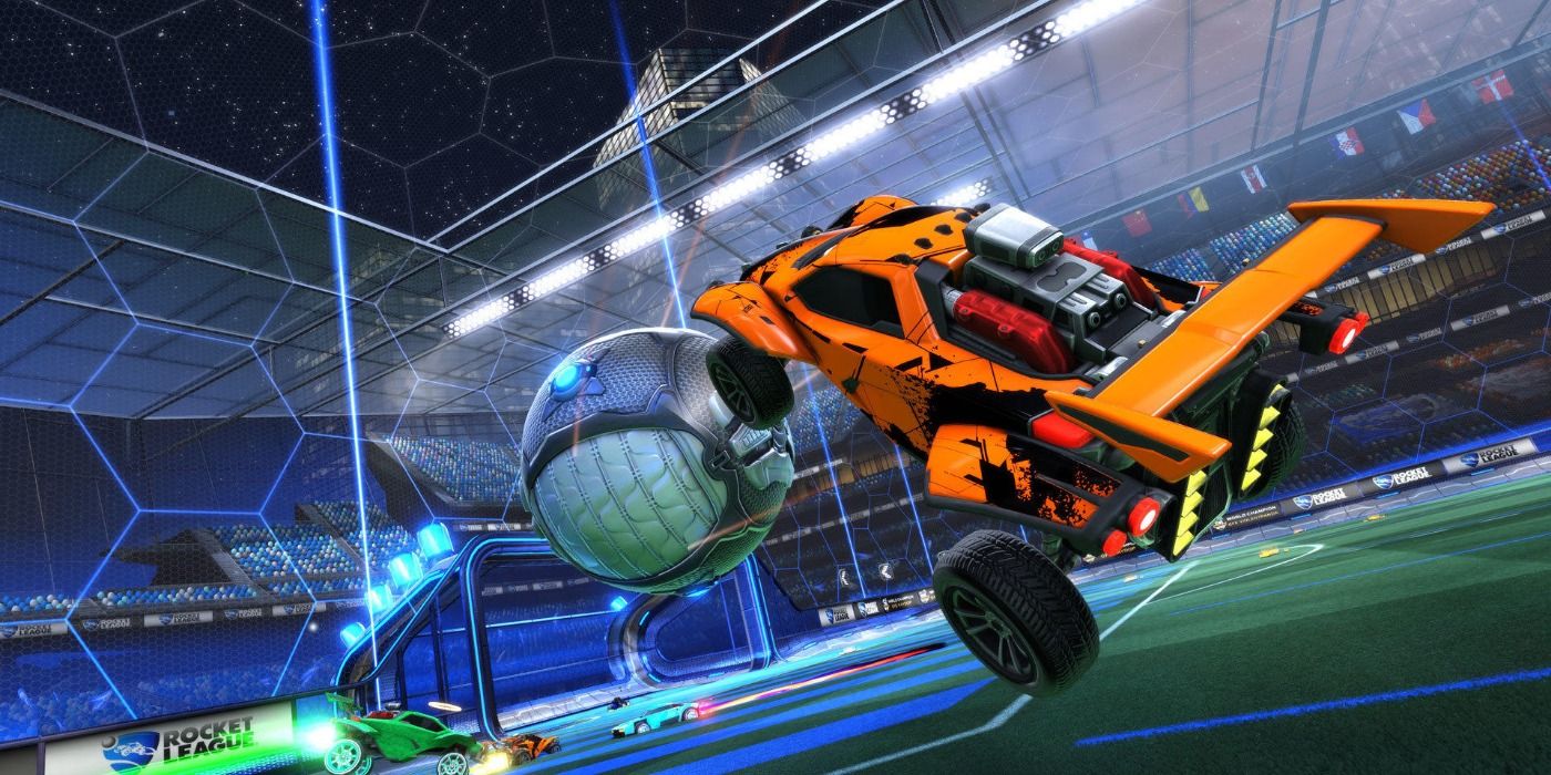 An orange car hits the ball with an aerial strike.