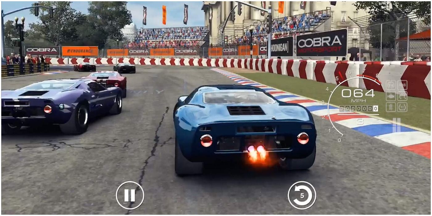 An In-Game Screenshot of Grid Autosport with 5 Cars Approaching A Corner, One Using Boost..