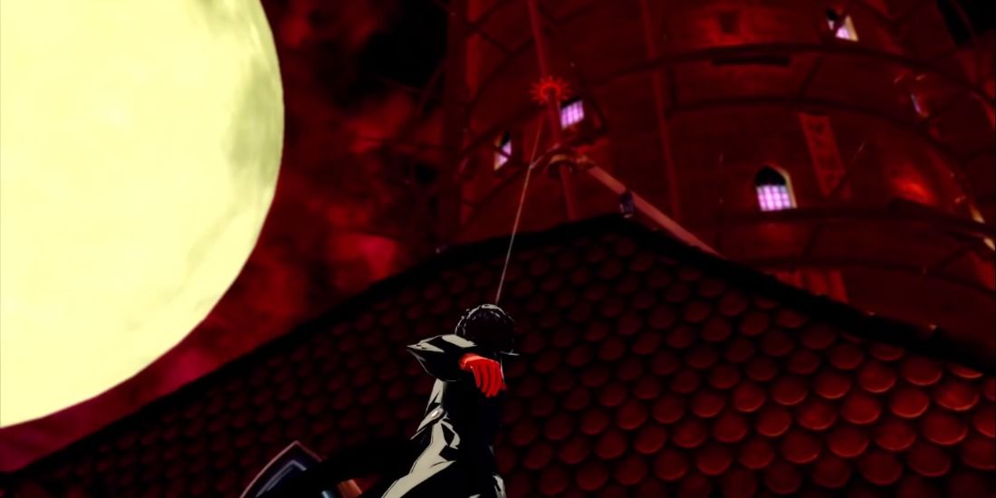 Joker scaling a building with his grappling hook beside the giant moon in Persona 5 Royal