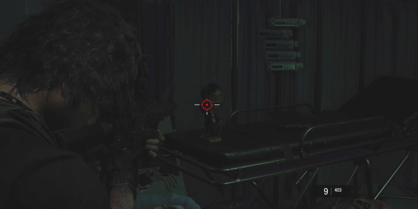 Resident Evil 3 Screenshot Of Charlie Doll In Hallway Gurney
