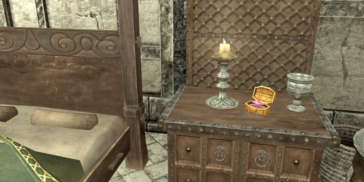 A purple stone floats in its golden case next to a luxurious bed.