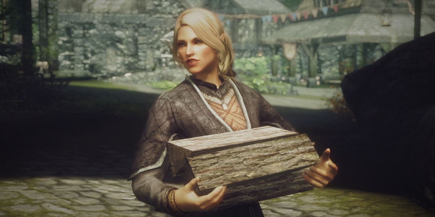 An elven woman dressed in fine clothes carries firewood through an ancient city.