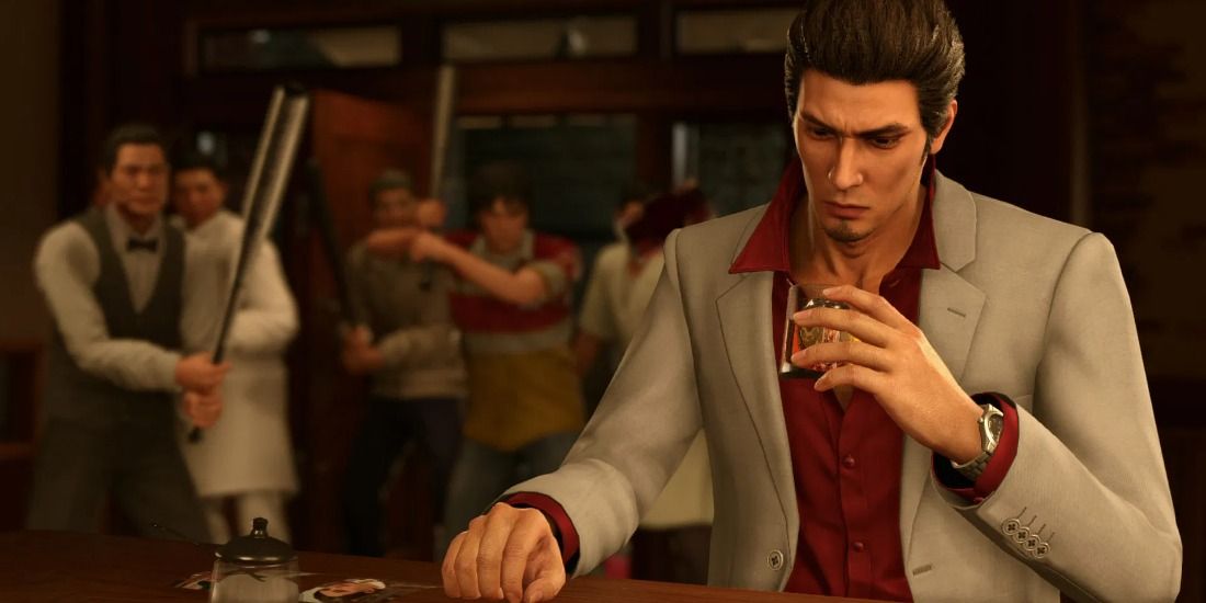 Kazuma drinking at a bar in Yakuza while a waiter comes at him with a baseball bat