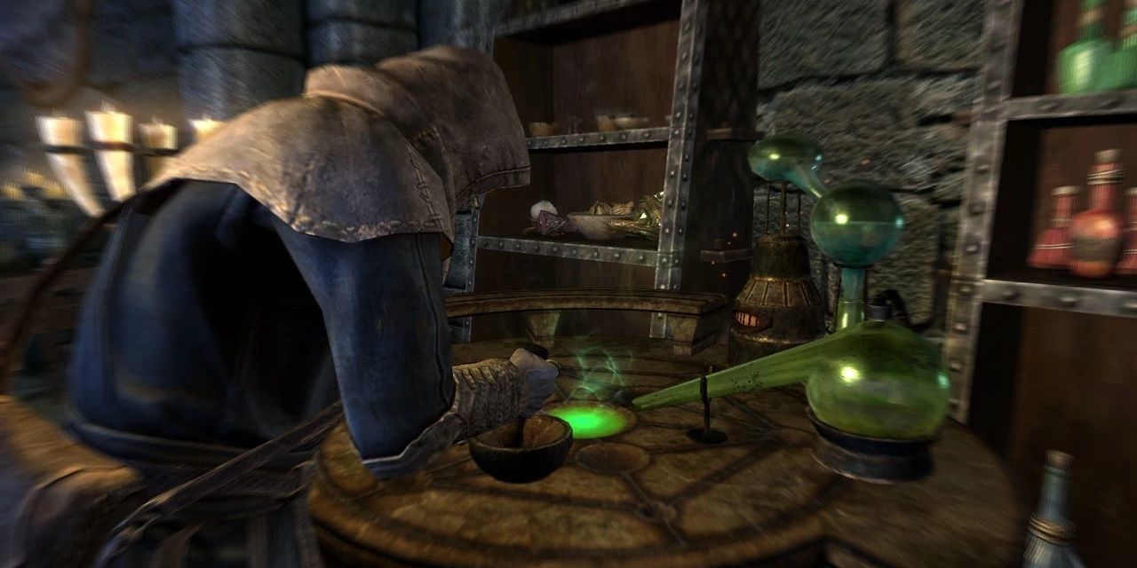 A photo of a mage in skyrim using an alchemy table to create potions.