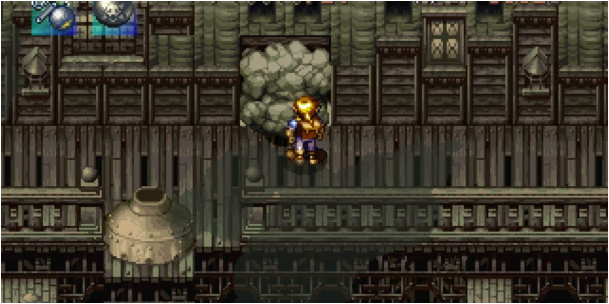 Alundra investigating a pile of rocks blocking an entrance