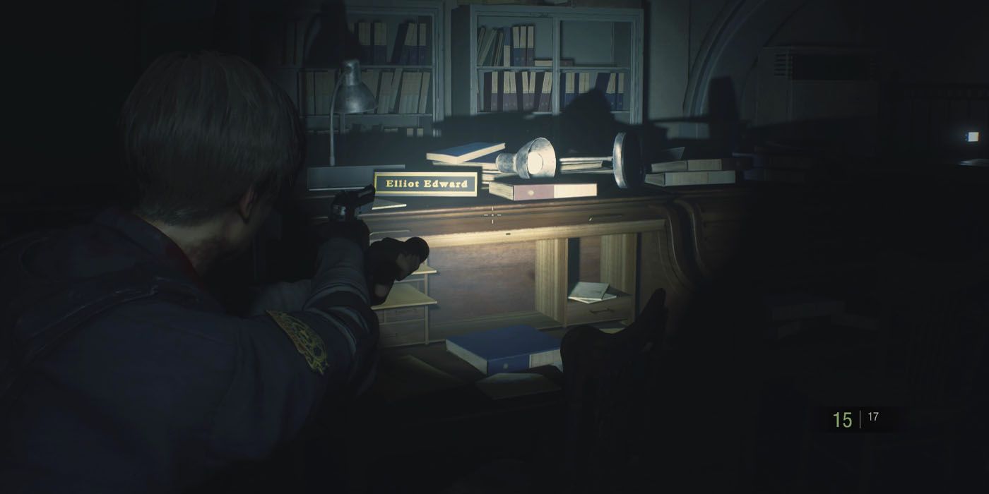 Resident Evil 2 Remake Screenshot Of Leon Aiming At Desk