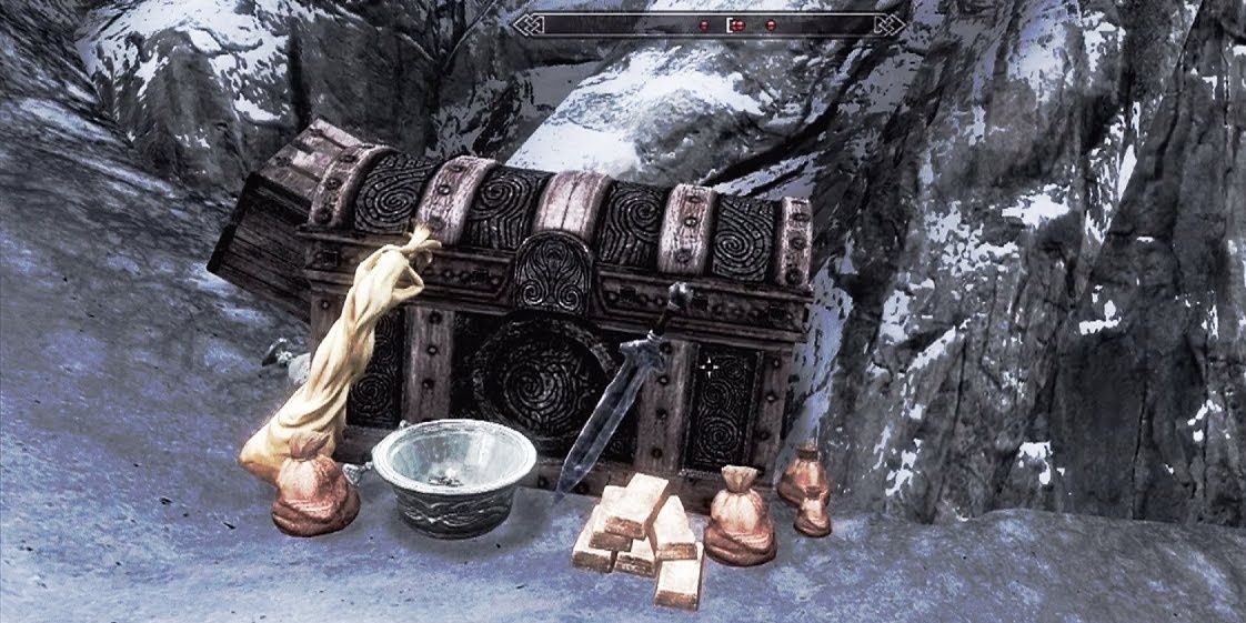 Screenshot of a skyrim treasure chest hidden among snowy mountains. Next to the chest is several gold ingots, a silver bowl, some animal hide, and a sack of coins.