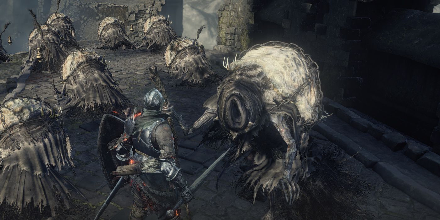 Dark Souls 3 Best NPCs Yoel of Londor among a graveyard of corpses 